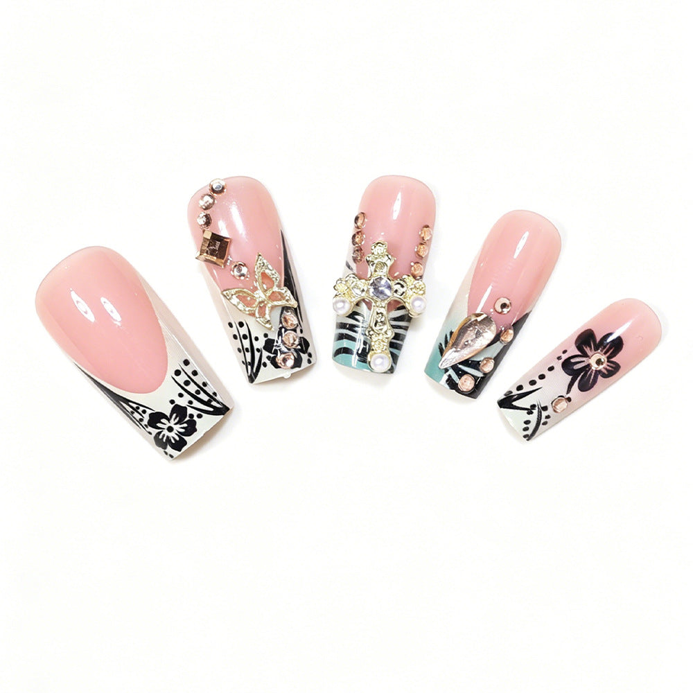 Artistic Stiletto Nail Design with Floral Accents and Gems Acalora