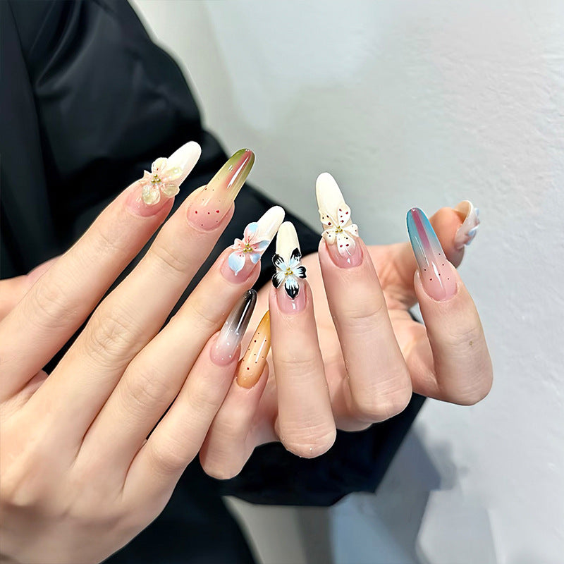 Artificial nail set with glamorous floral designs and creative glitter accents Acalora