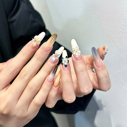 Artificial nail set with glamorous floral designs and creative glitter accents Acalora