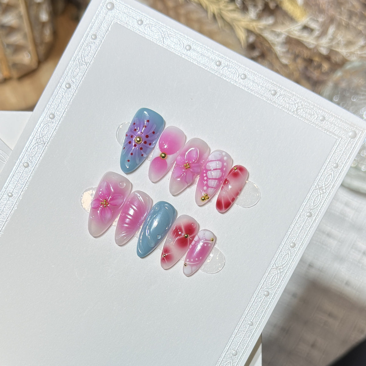 Artistic Press-On Nail Set with Floral and Abstract Designs Acalora