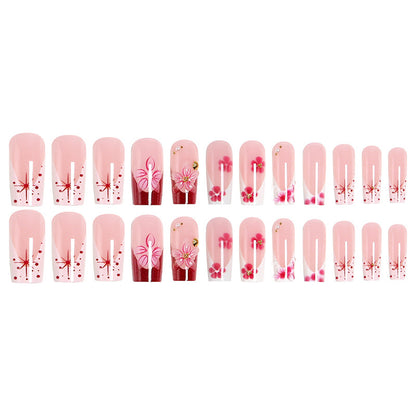 Artificial nail set with floral detail and glitter effects Acalora