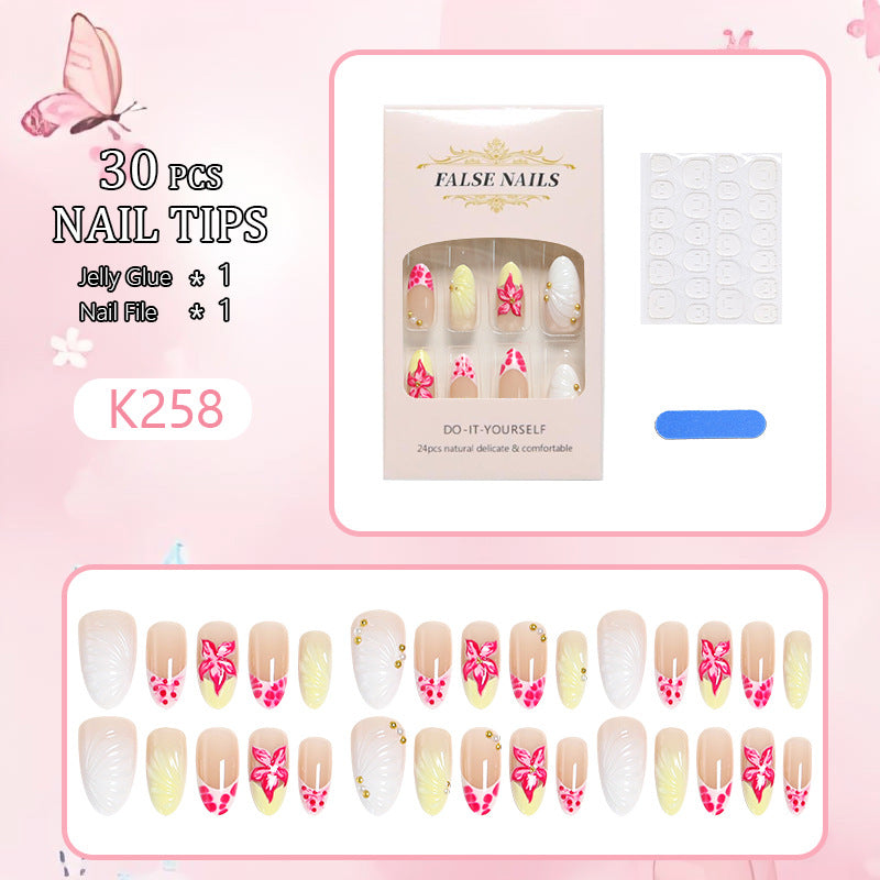Artificial nail set with floral motifs and elegant embellishments Acalora