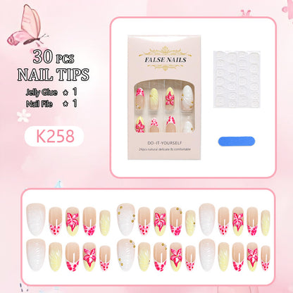 Artificial nail set with floral motifs and elegant embellishments Acalora