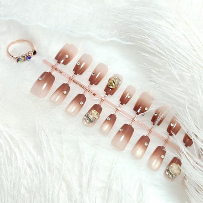 Artificials nails in elegant ombre style with rhinestone embellished applications Acalora