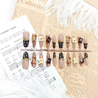 Artificial nails with playful animal designs and glitter effects Acalora