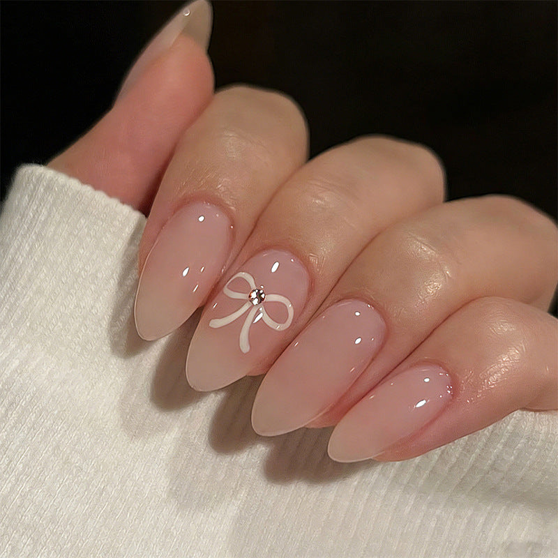 Acrylic nail set with elegant bow accents Acalora