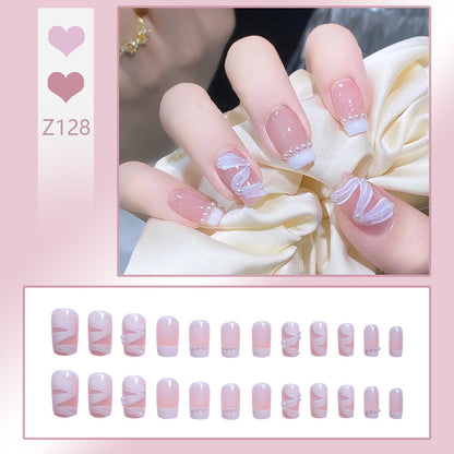 Elegant artificial nail set with stylish wave pattern and pearl accents Acalora