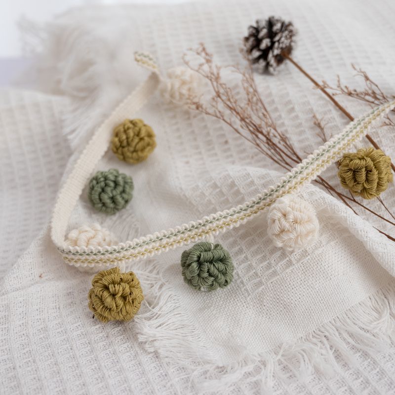 Decorative border with pompons Acalora