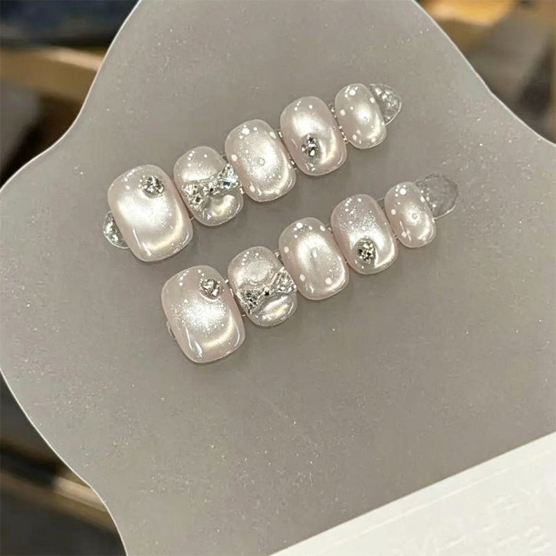 Artificial nail set with elegant glitter and crystal decorations Acalora