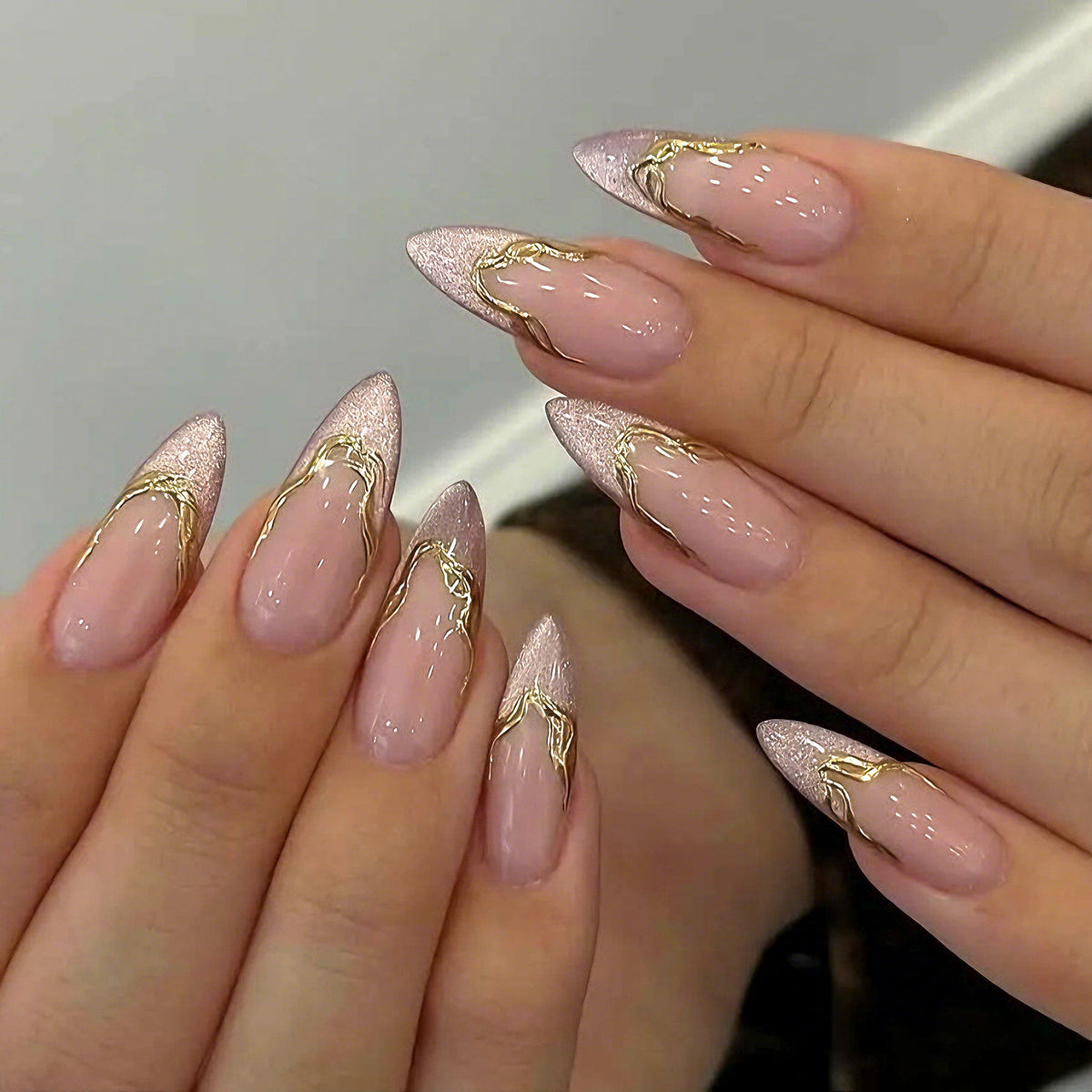 Acrylic nail set with glamorous tips and golden accents Acalora