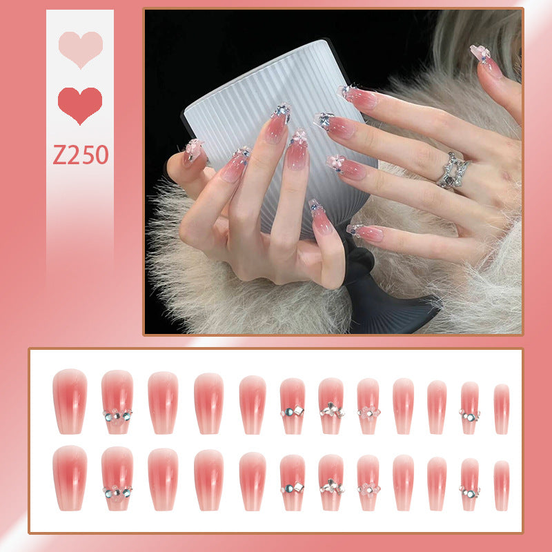 Artificial nail set with glamorous 3D decorations and shimmering accents Acalora