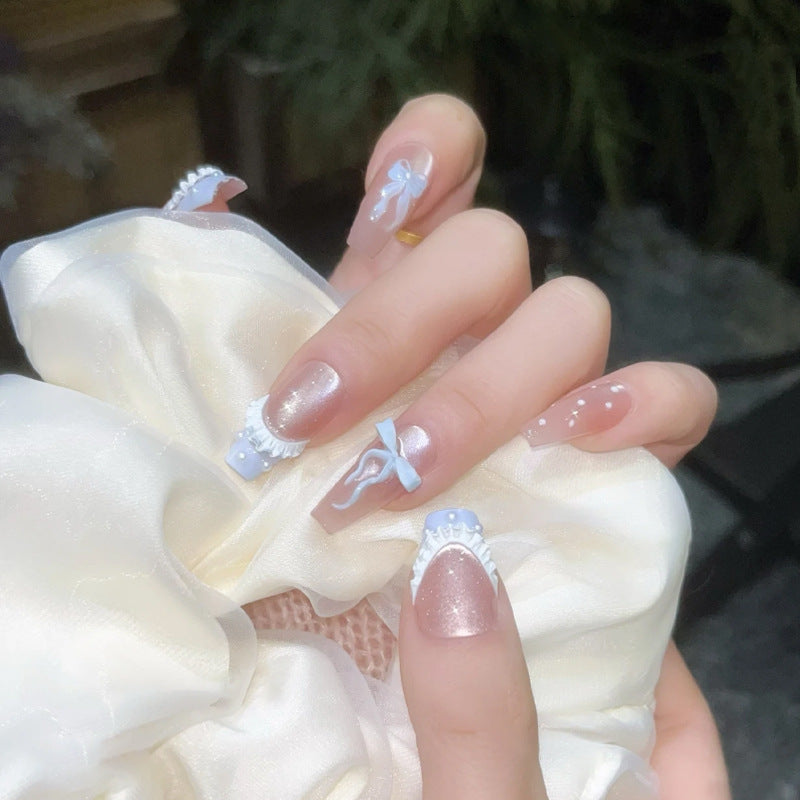 Art nail set with filigree bows and glitter accents Acalora