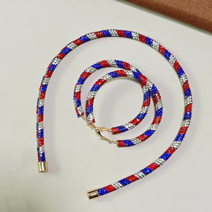 Women's handcrafted crystal pavé hoop earrings with curved tube element and clasp closure Bowlift