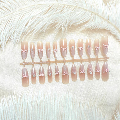Artificial nails with elegant glitter and bow design Acalora