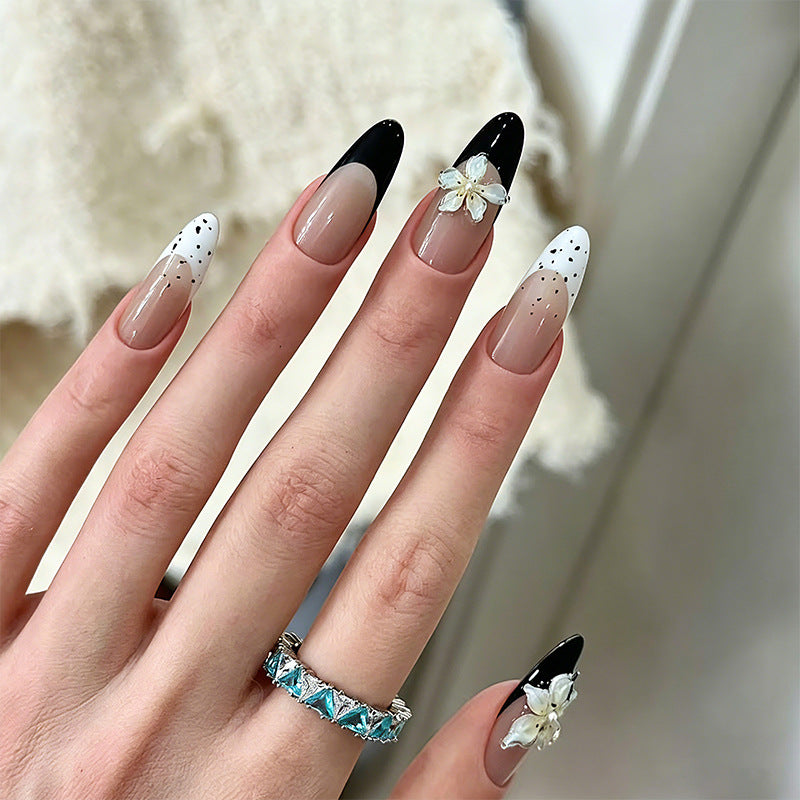 Artificial nail set with glamorous floral designs and creative glitter accents Acalora