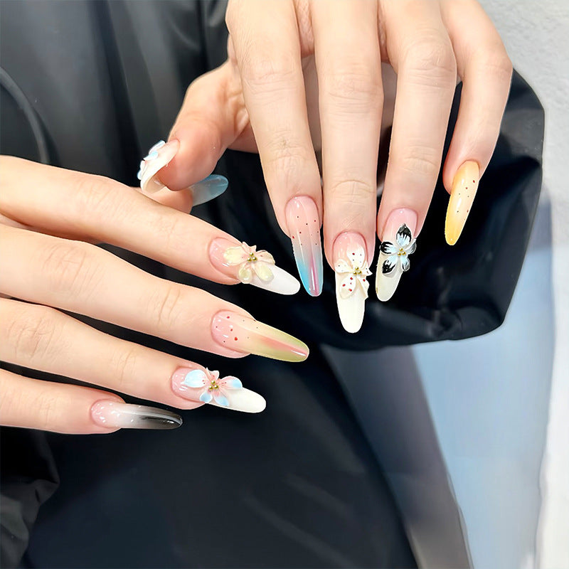 Artificial nail set with floral and glittering decorations Acalora