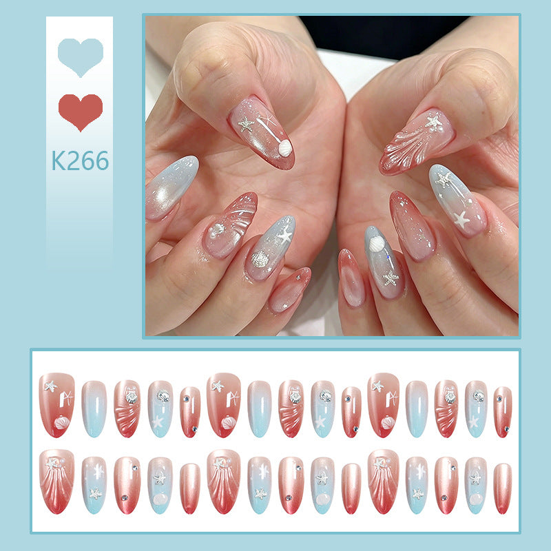Artificial nails with sparkling rhinestone embellishments and maritime design Acalora