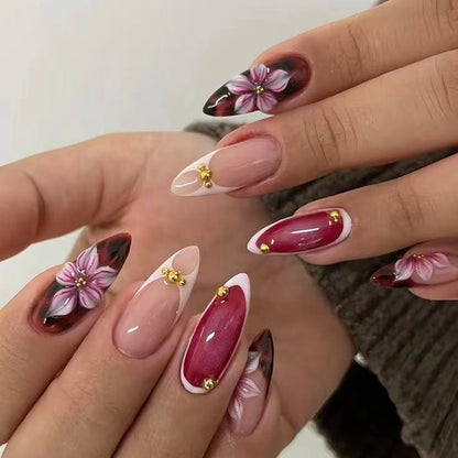 Nail set with elegant floral accents and high gloss finish Acalora