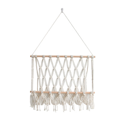 Elegant macramé wall hanging with decorative tassels and wooden frame