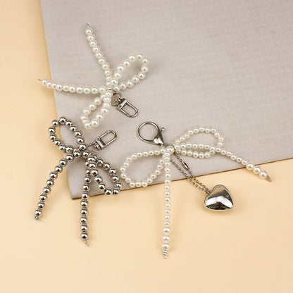 Elegant Pearl Bow Brooch Acalora