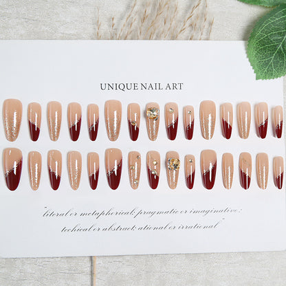 Acrylic nail set with elegant glitter design and exclusive embellishments Acalora