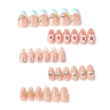 Acrylic nail set with filigree shell and flower decorations Acalora