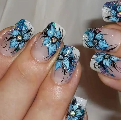 Artificial nail set with intricate floral designs and glitter elements Acalora