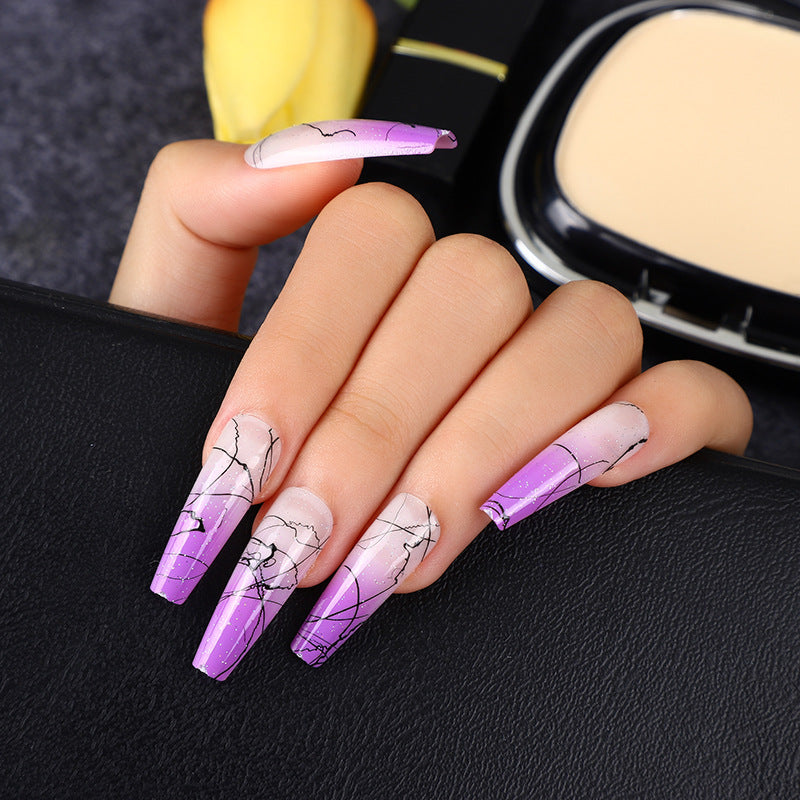 Artificial nails in modern ombre design with marbled accents Acalora