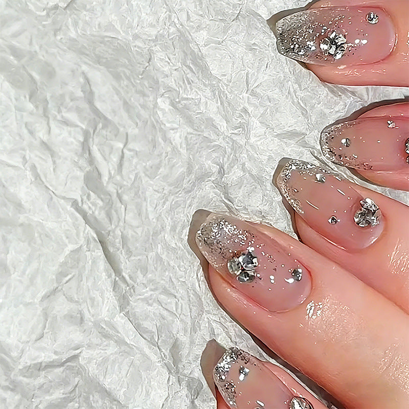 Acrylic nail set with extravagant glitter and crystal embellishments Acalora