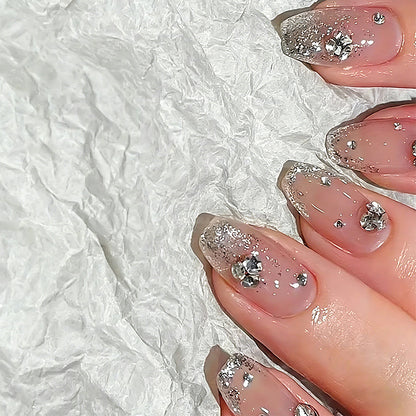 Acrylic nail set with extravagant glitter and crystal embellishments Acalora