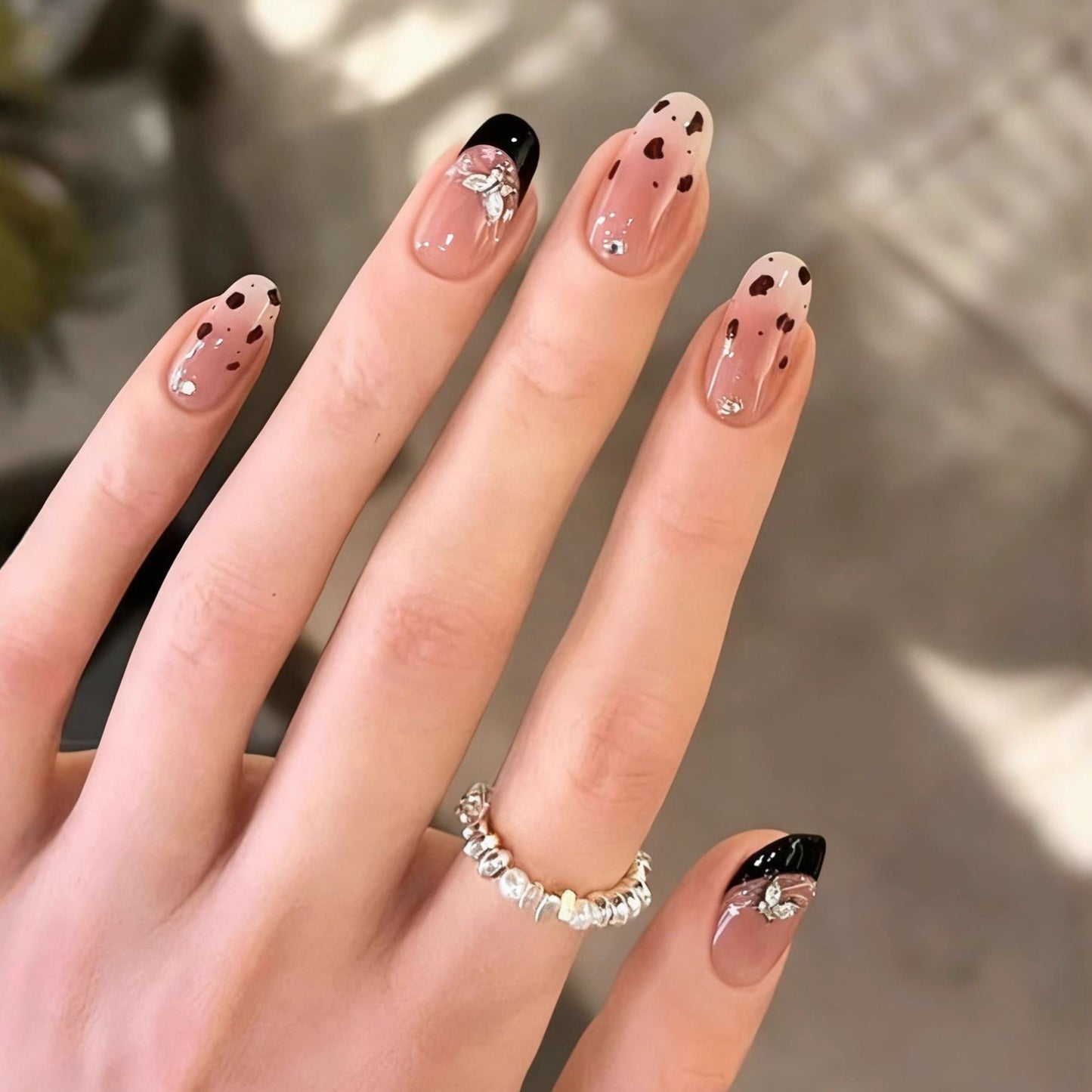 Artificial nails in a modern style with elegant embellishments Acalora