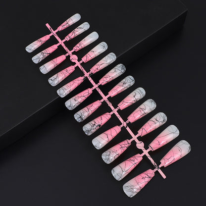 Artificial nails in modern ombre design with marbled accents Acalora