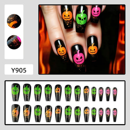 Halloween-style artificial nails with graphic pumpkin designs Acalora