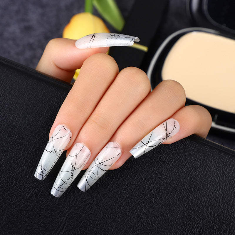 Artificial nails in modern ombre design with marbled accents Acalora