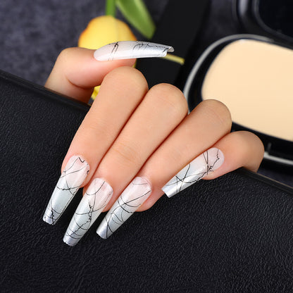 Artificial nails in modern ombre design with marbled accents Acalora
