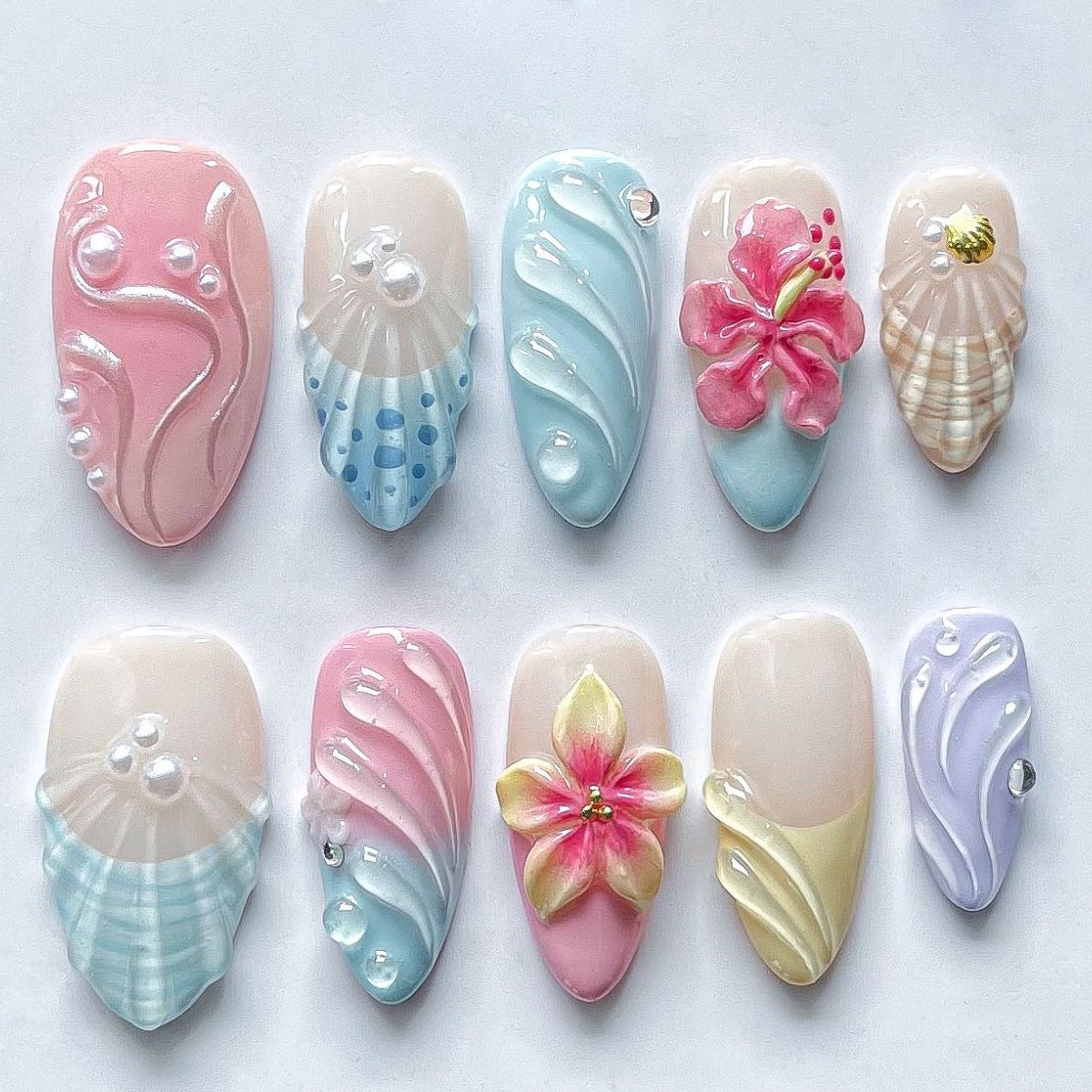 Nail art set with floral patterns and ombre effects Acalora