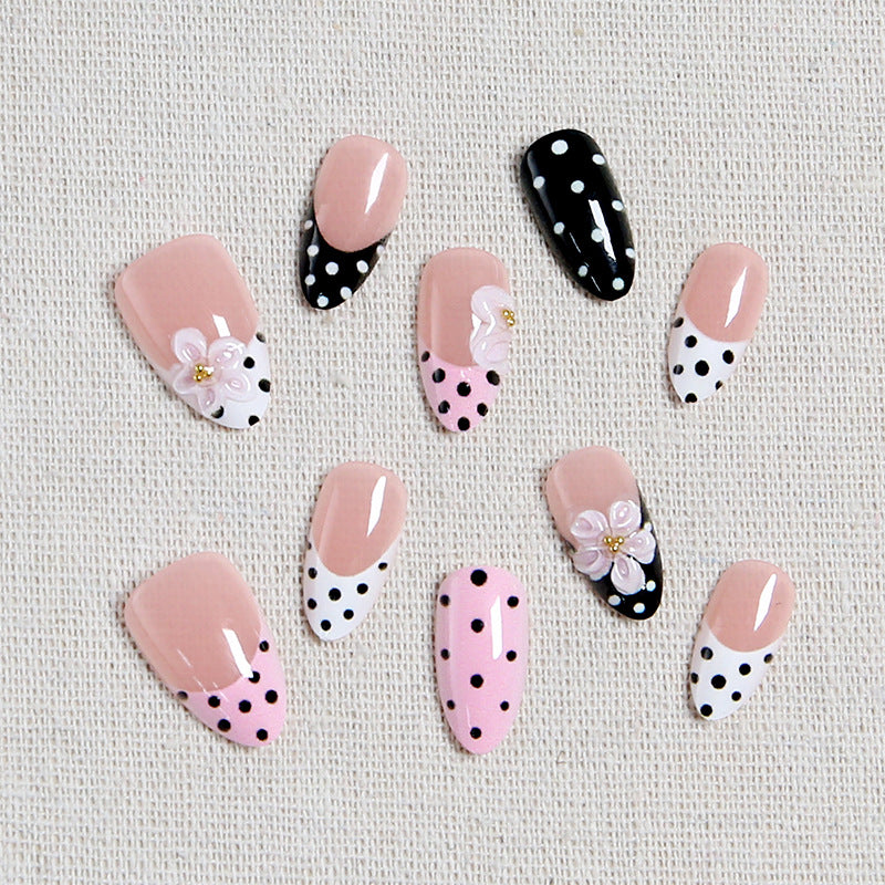 Nail art set with floral accents and elegant dots Acalora