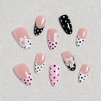 Nail art set with floral accents and elegant dots Acalora