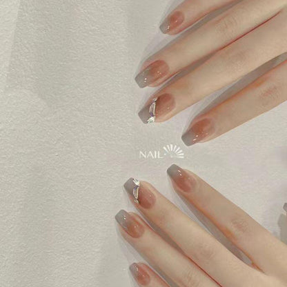 Artificial nail set with elegant ombre design and sparkling applications Acalora