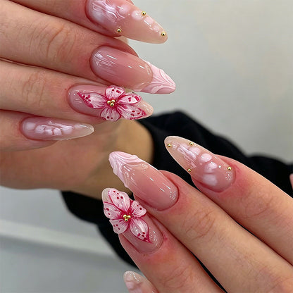 Artificial nail set with glamorous floral designs and creative glitter accents Acalora