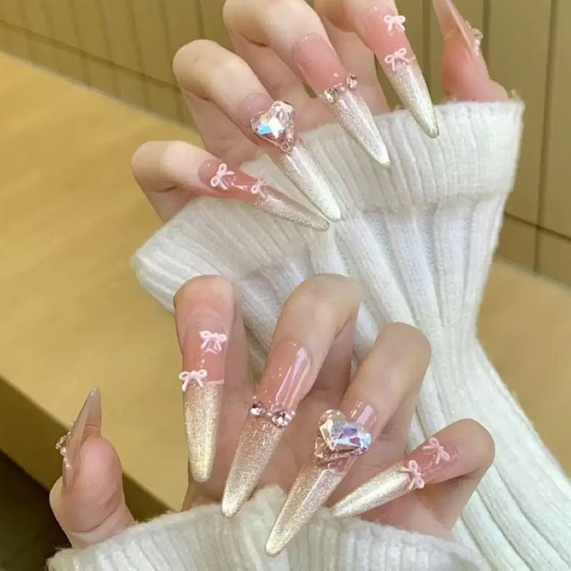 Art nail set with sparkling tips and delicate bow decorations Acalora
