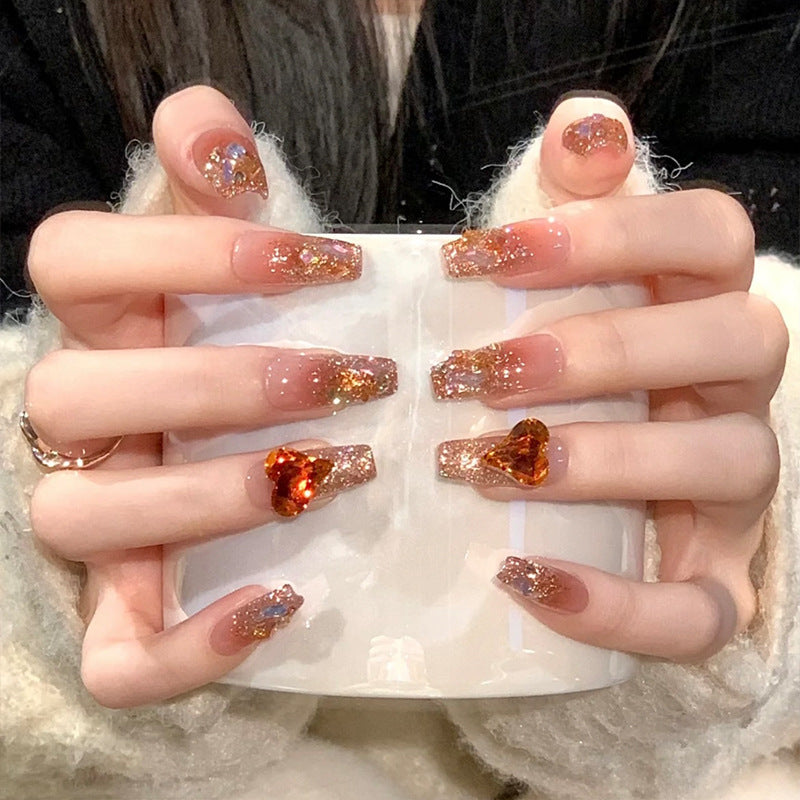 Artificial nail set with glitter and heart accents Acalora
