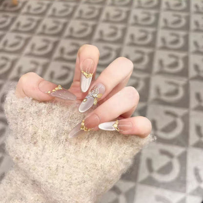 Glamorous art nails with elegant golden details Acalora