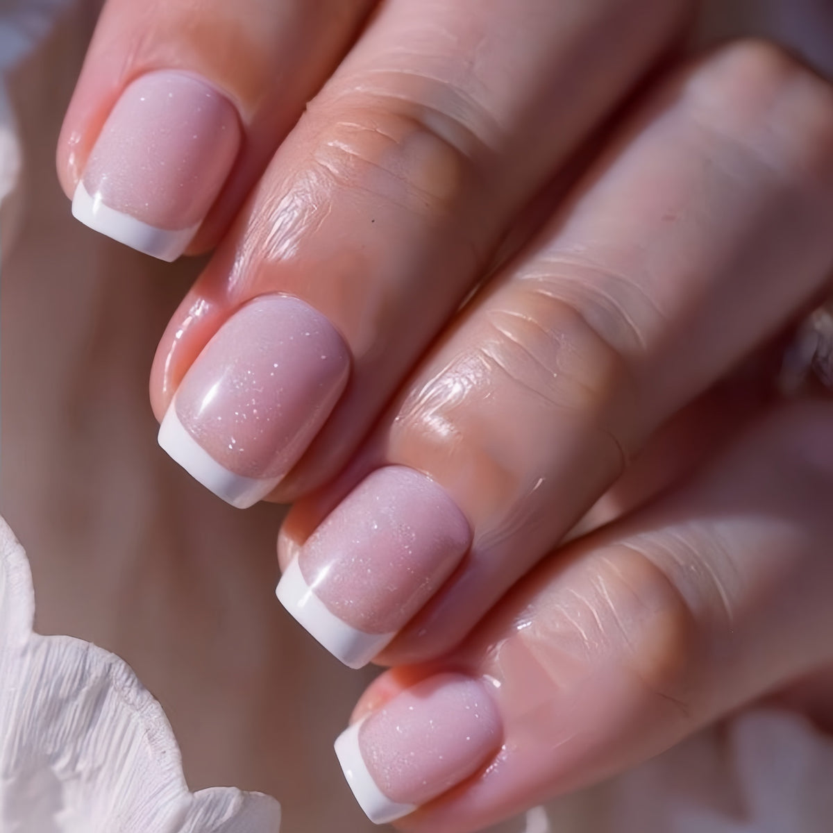 Artificial nails in elegant French tip design Acalora