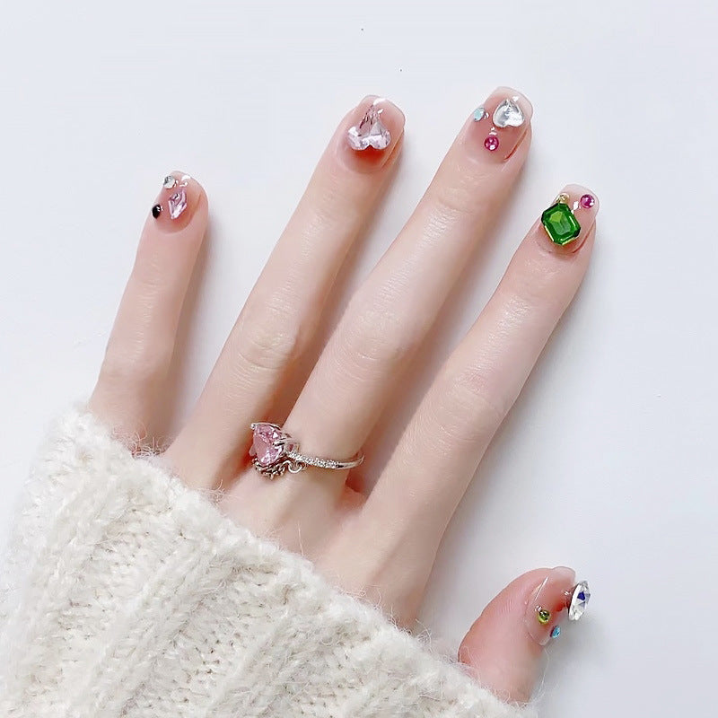 Acrylic nail set with sparkling 3D applications and beautiful heart designs Acalora