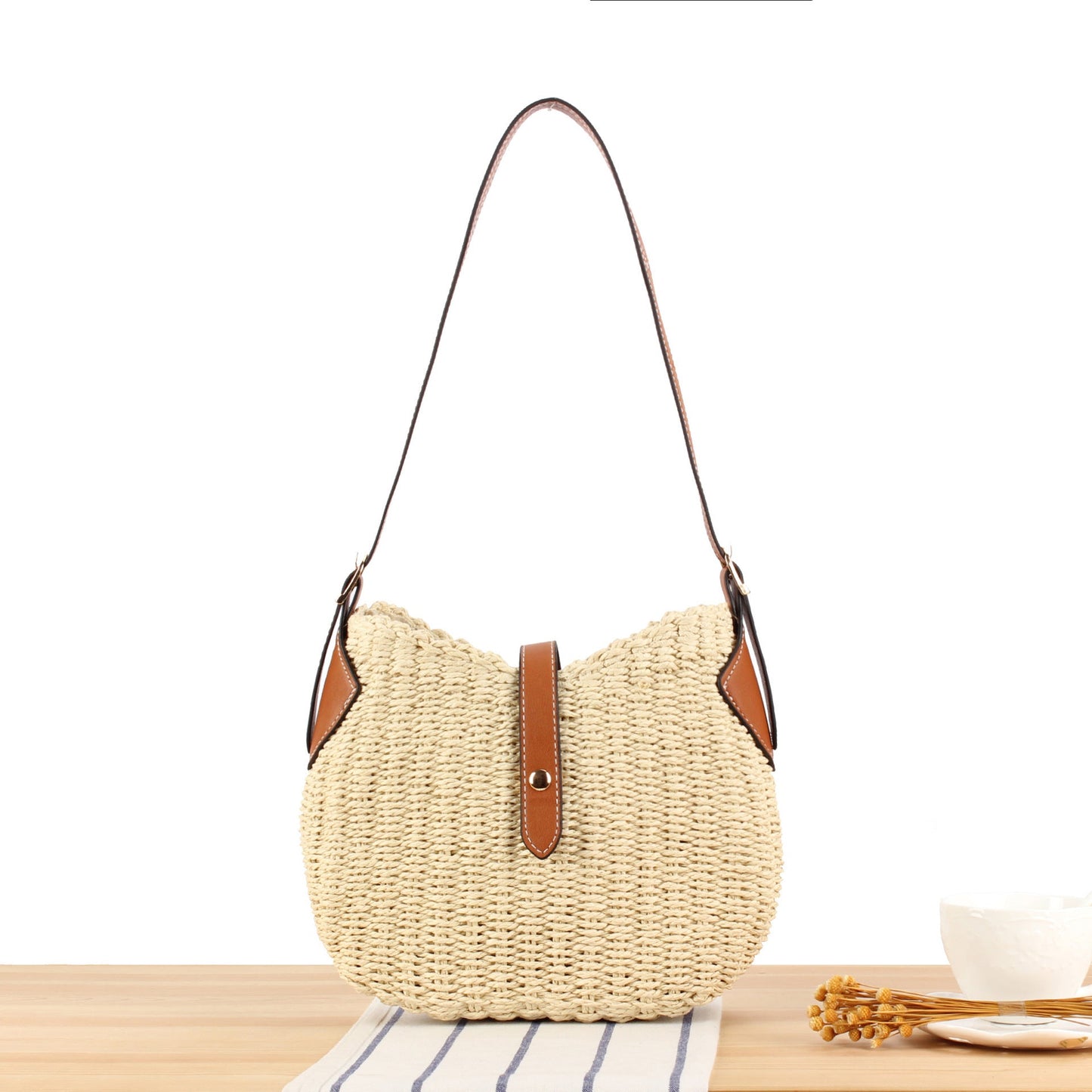 Braided shoulder bag with elegant leather accents Bowlift