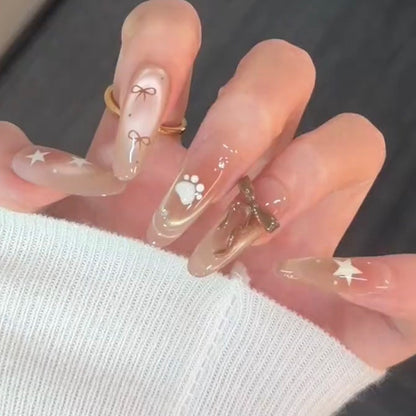 Artificial nail set with festive gift design and elegant glitter accents Acalora