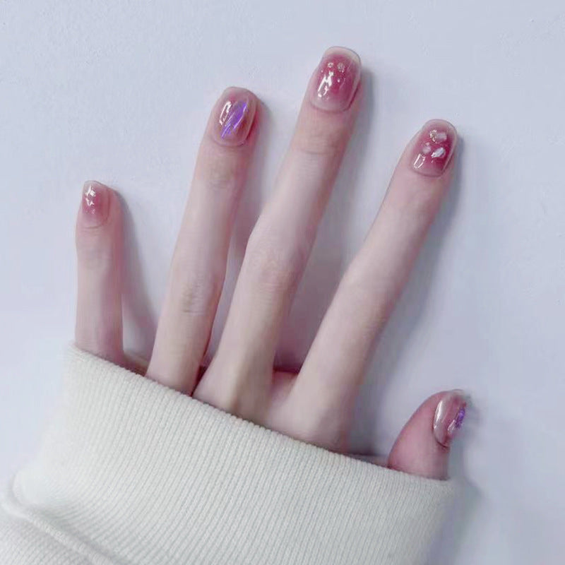 Artificial nails with delicate glitter design and floral accent Acalora