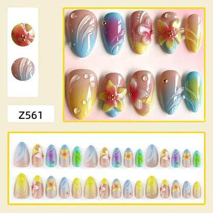 Acrylic nail set with floral elements and colorful accents Acalora