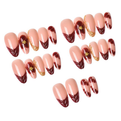Exclusive artificial nails with floral designs and gold embellishments Acalora